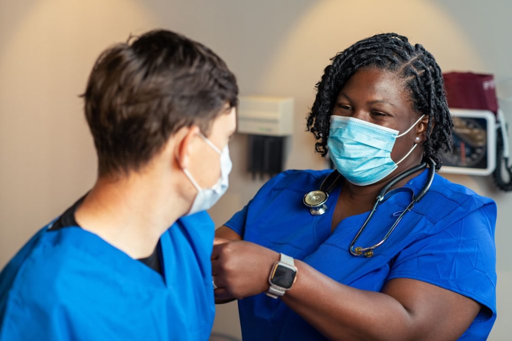 Caption: In this 2022 photo, captured inside a clinical setting, a health care provider places a bandage on the injection site of a patient who just received an influenza vaccine. The best way to prevent seasonal flu is to get vaccinated every year. Centers for Disease Control and Prevention (CDC) recommends everyone 6-months of age and older get a flu vaccine every season. Content Providers(s): CDC/ Robin Spratling Creation Date: 2022 Photo Credit: Brandon Clifton ID#: 26180 https://phil.cdc.gov/Details.aspx?pid=26180